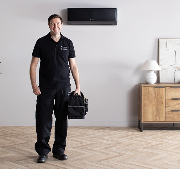 installer with kit in front of air con